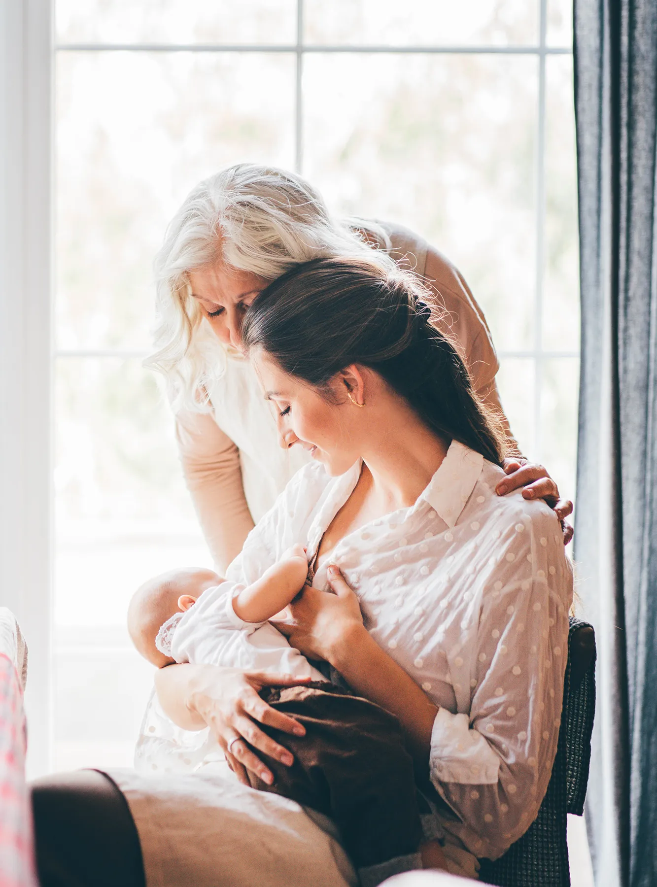 young-woman-breastfeeds-baby-and-talks-to-grey-hai-2025-01-09-05-25-43-utc